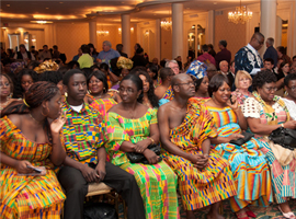 Participants await the start of the opening plenary.
