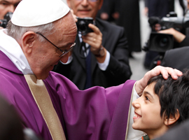 Pope-Francis-greets-boy-after-celebrating-Mass-at-St.-Anne's-Parish-within-Vatican-cns-paul-haring.jpg
