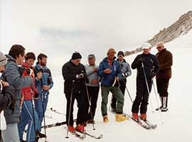 Pope John Paul II (center, in red boots) prays with a group of skiers before heading down a slope in this 1984. CNS photo from the Vatican.
