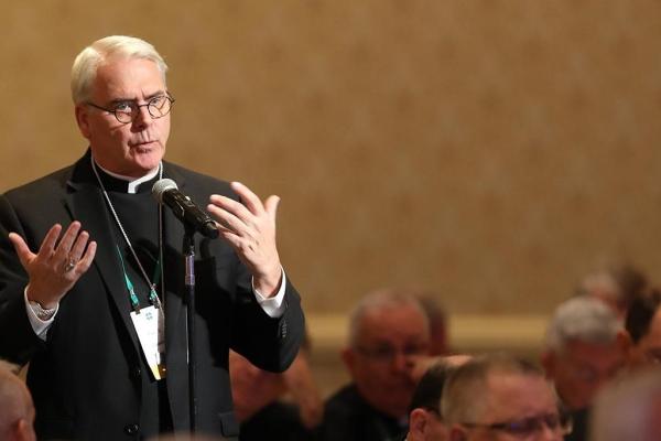 Archbishop Paul Coakley speaks during a general assembly