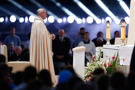 Pope Francis prays during the benediction at a July 30 World Youth Day prayer vigil at the Field of Mercy in Krakow, Poland. (CNS photo/Paul Haring)