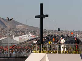 Pope Francis arrives to pray at a cross on the border with El Paso, Texas, before celebrating Mass at the fairgrounds in Ciudad Juarez, Mexico, in Feb. 2016. CNS photo/Paul Haring