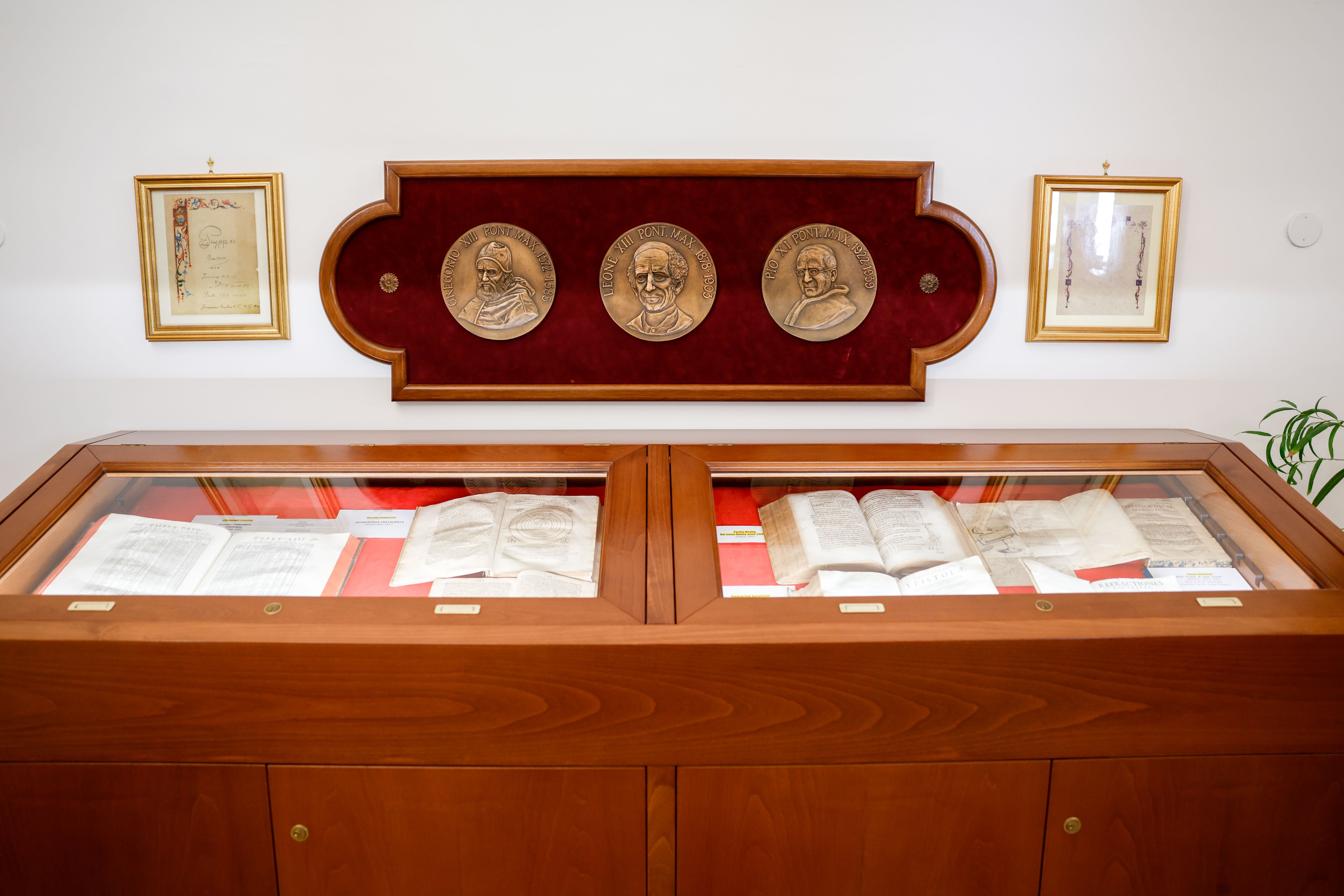 Display case shows 16th-century books. 
