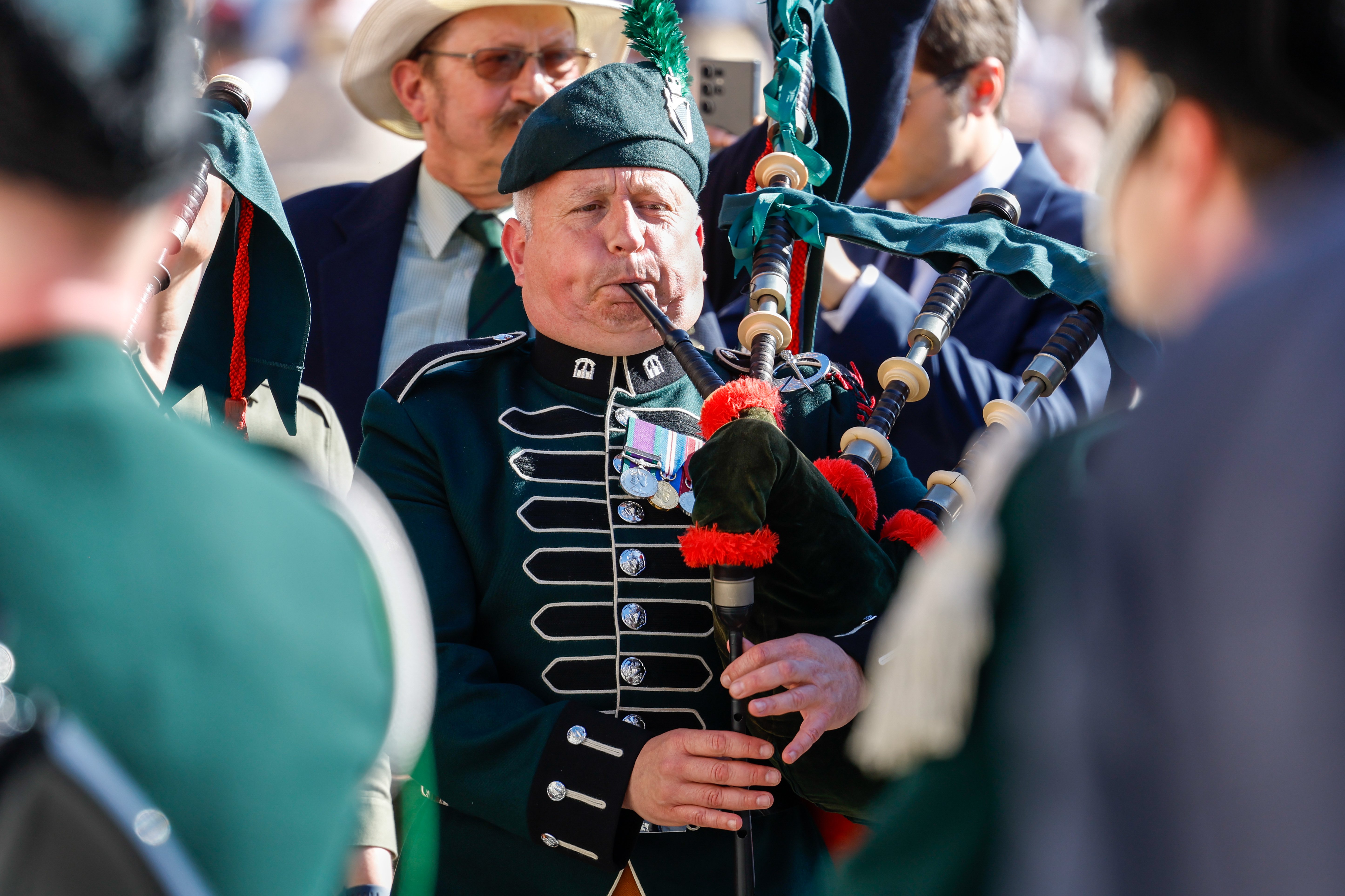 A man plays a bagpipe.
