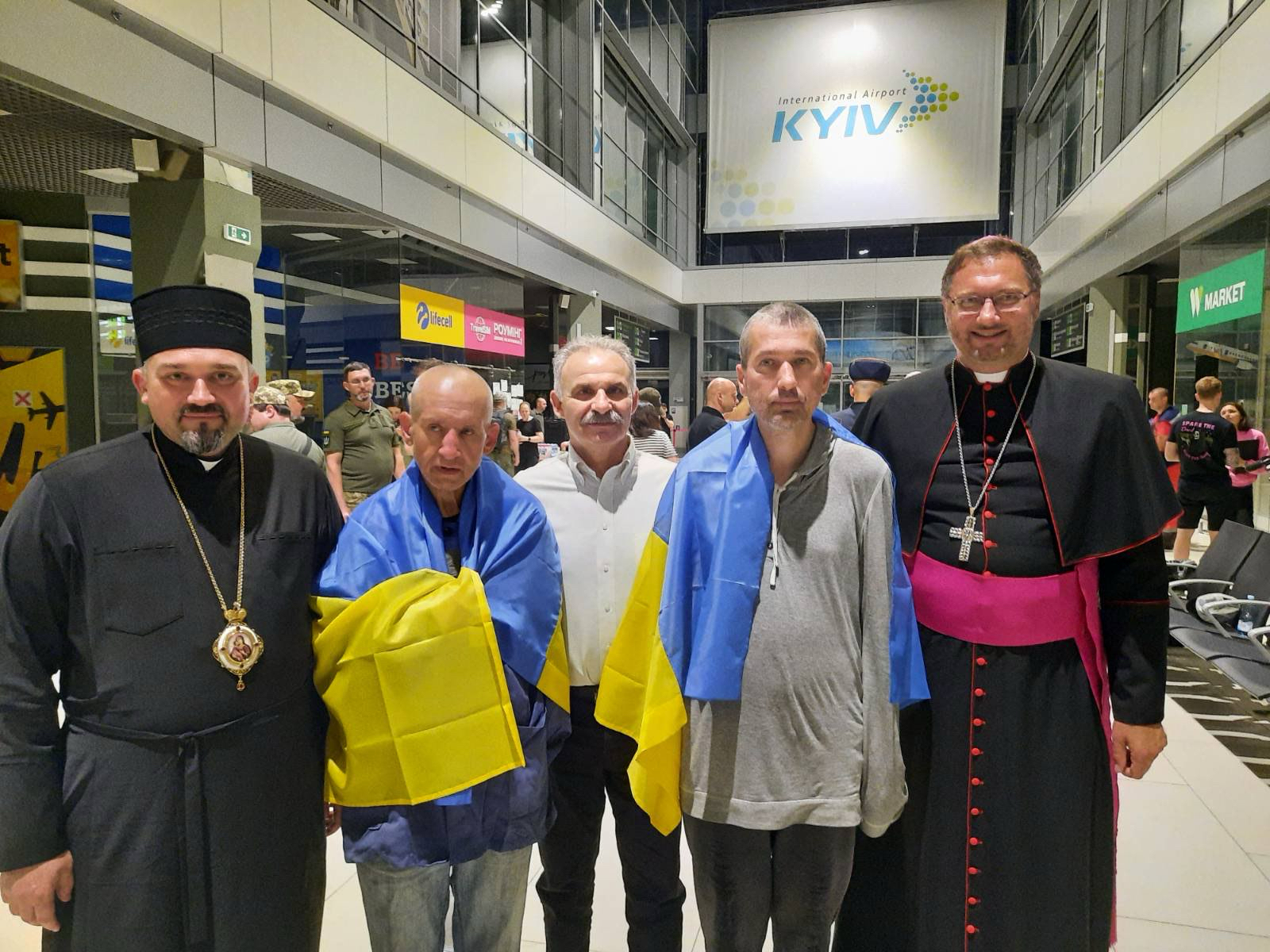 Ukrainian priests in the Kyiv airport.
