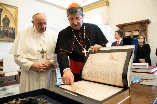 Pope Francis looks at items related to Dante