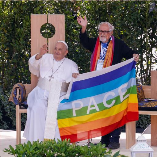 Pope Francis greets people at a meeting on peace