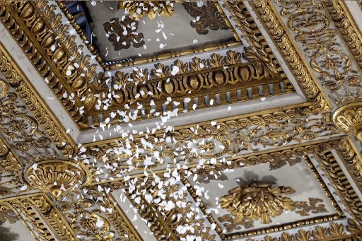 rose petals fall from the ceiling of the Basilica of St. Mary Major