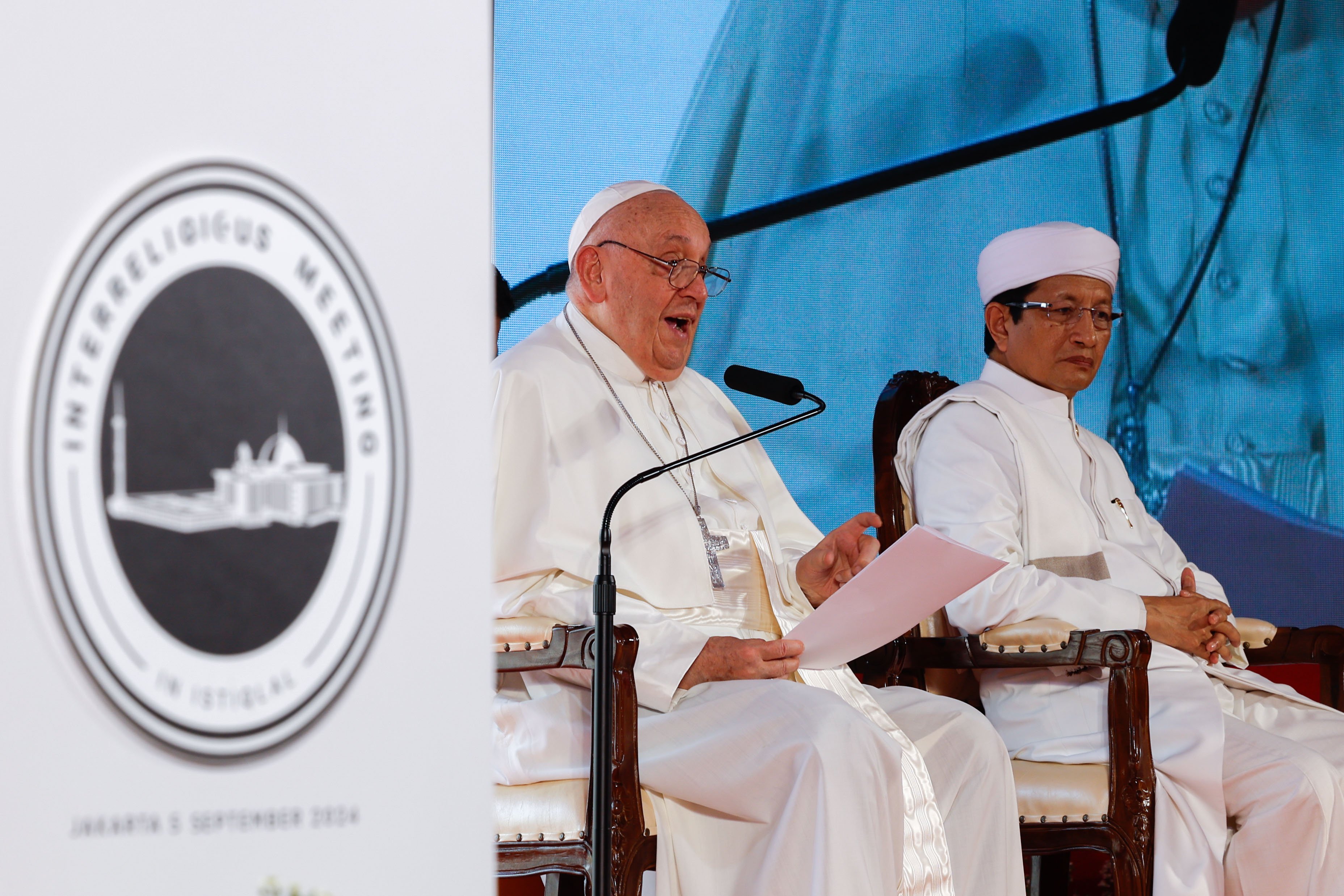 Pope Francis speaks at a mosque.