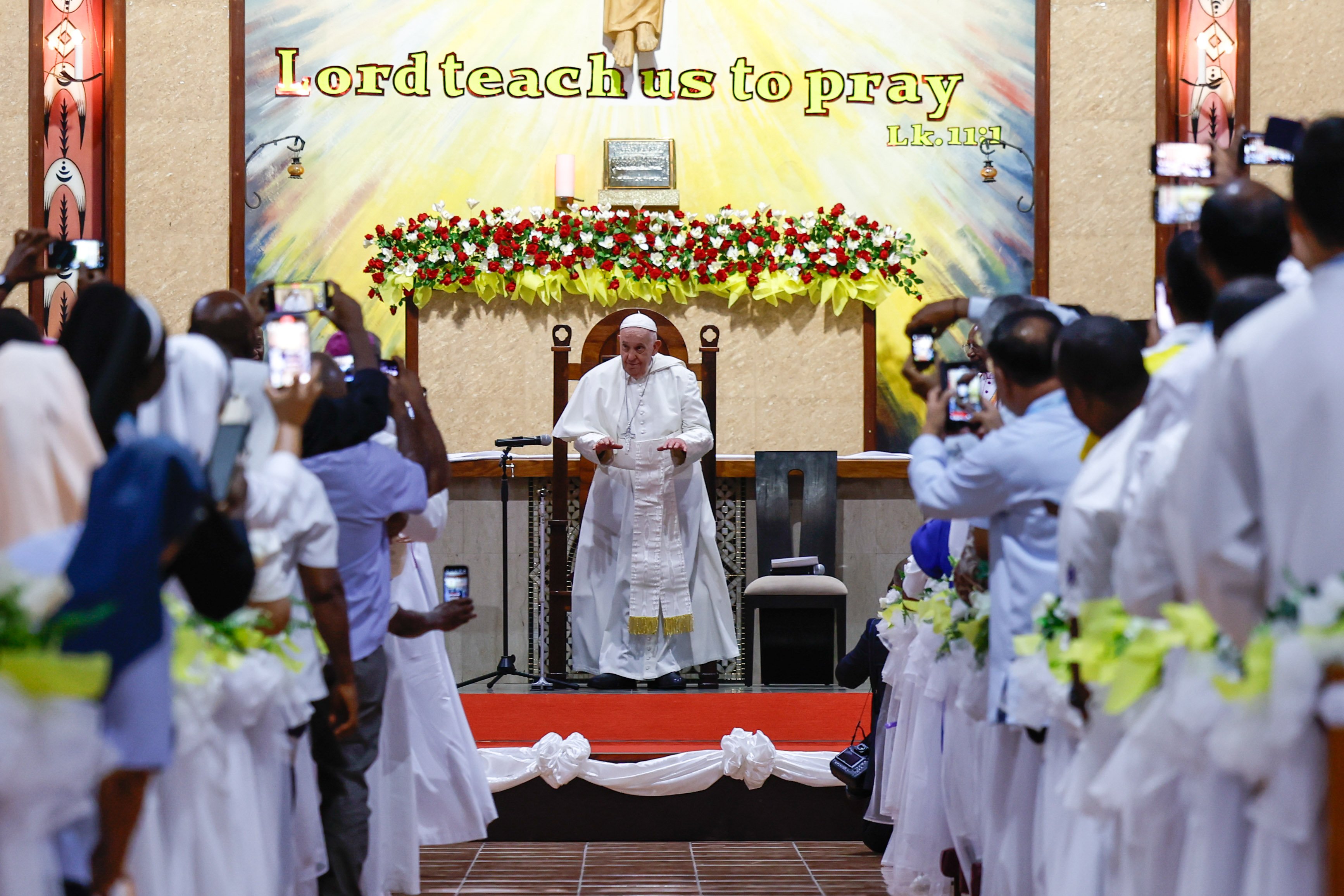 Pope Francis meets with churchworkers in Papua New Guinea.