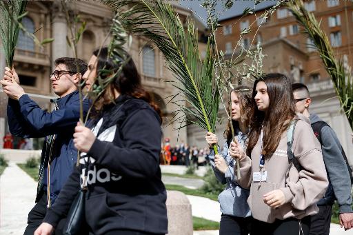 Young people in a procession on Palm Sunday at the Vatican