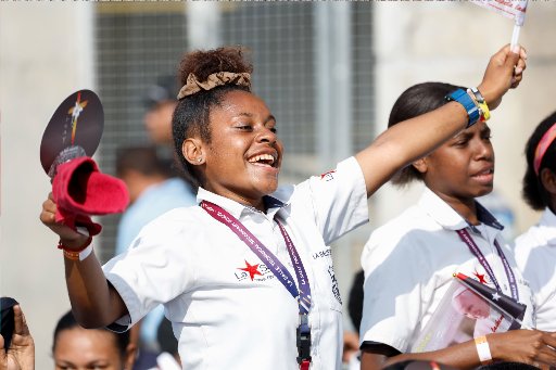 Young woman cheers for Pope Francis