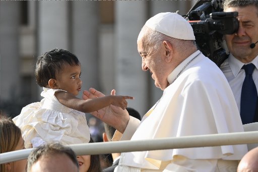 Pope Francis with a child