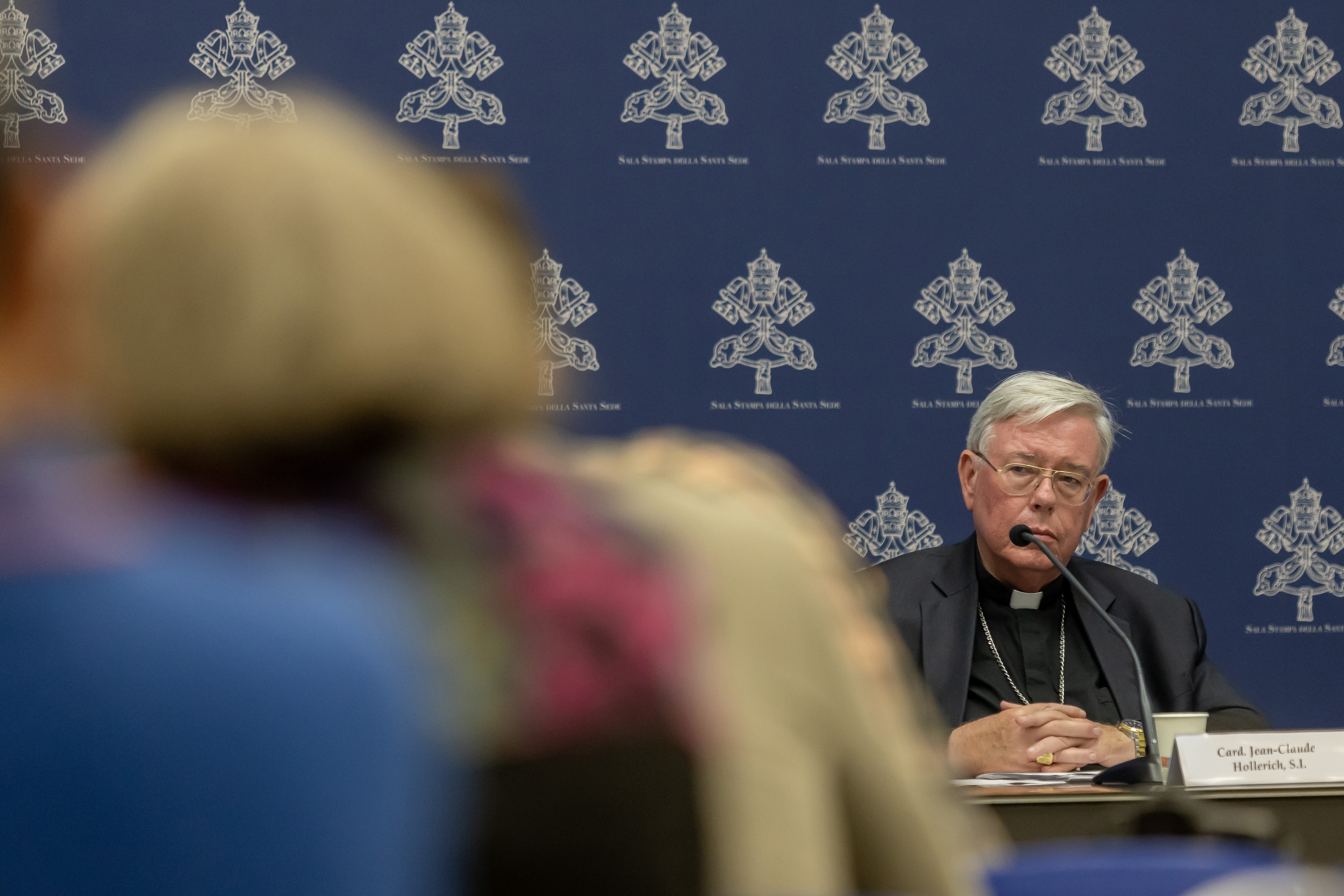 Cardinal Mario Grech speaks at a news conference.