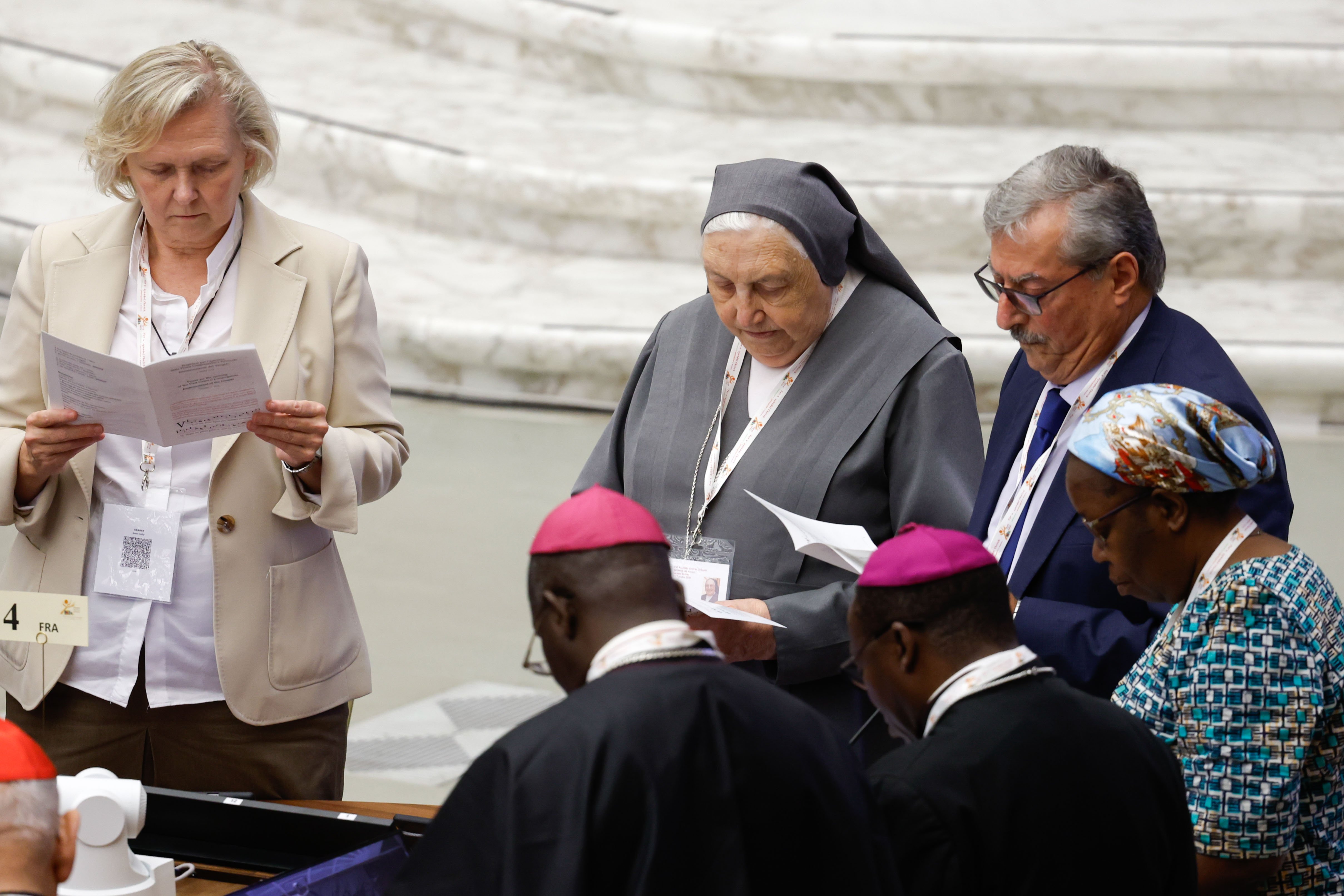 Members of the Synod of Bishops pray