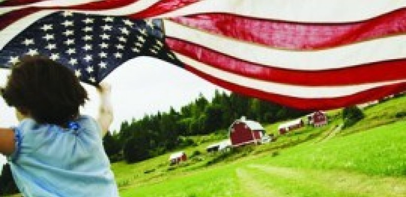 girl runs by barn with American flag montage