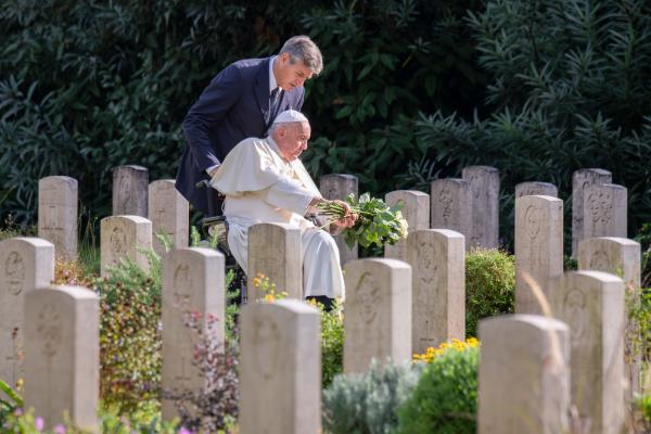 Pope Francis in a cemetery.