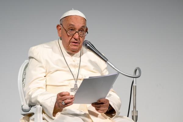 Pope Francis speaks during a conference.