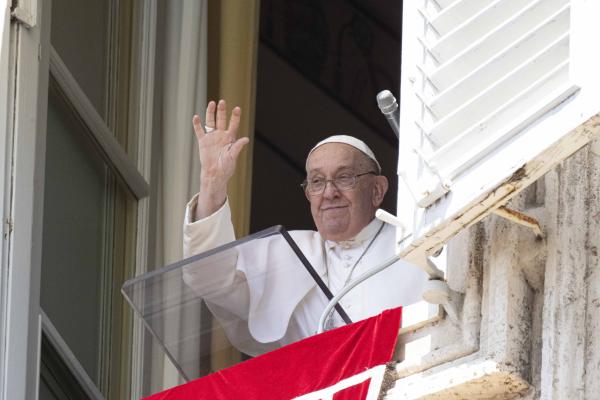 Pope Francis greets visitors in St. Peter's Square.