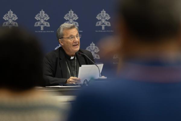 Cardinal Mario Grech speaks at a news conference.