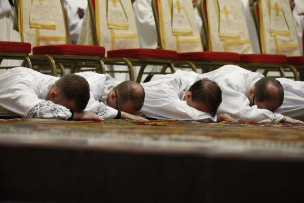 New deacons from the Pontifical North American College in Rome lie prostrate.