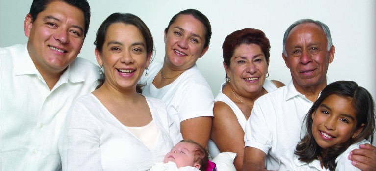 Intergenerational Hispanic Family all wearing white shirts