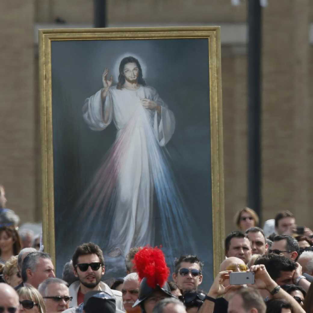 Divine mercy image in a crowd at St. Peter's Square in Rome