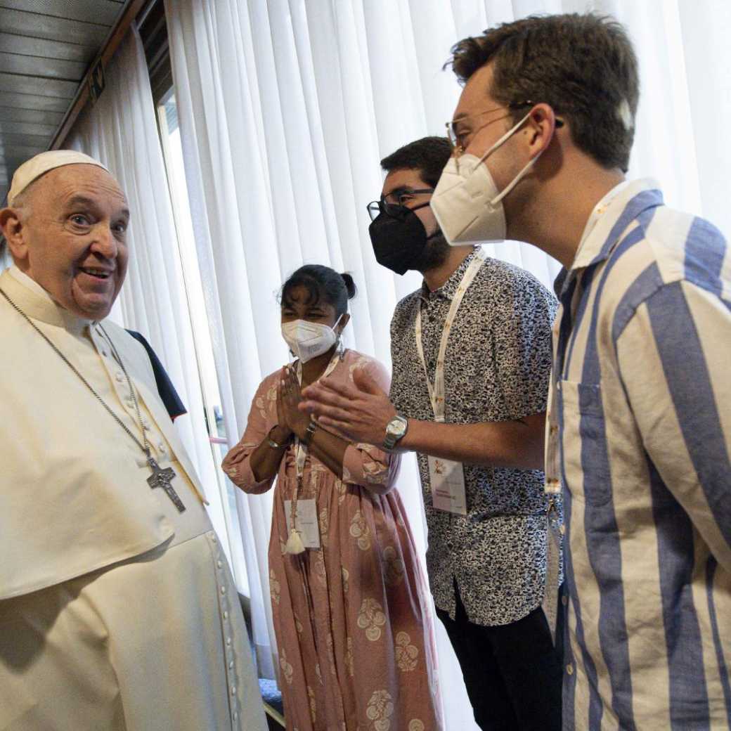 Pope Francis greets people during a meeting with representatives of bishops' conferences from around the world at the Vatican Oct. 9, 2021.