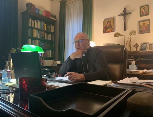 Cardinal Timothy Dolan watches the bishops meeting on zoom