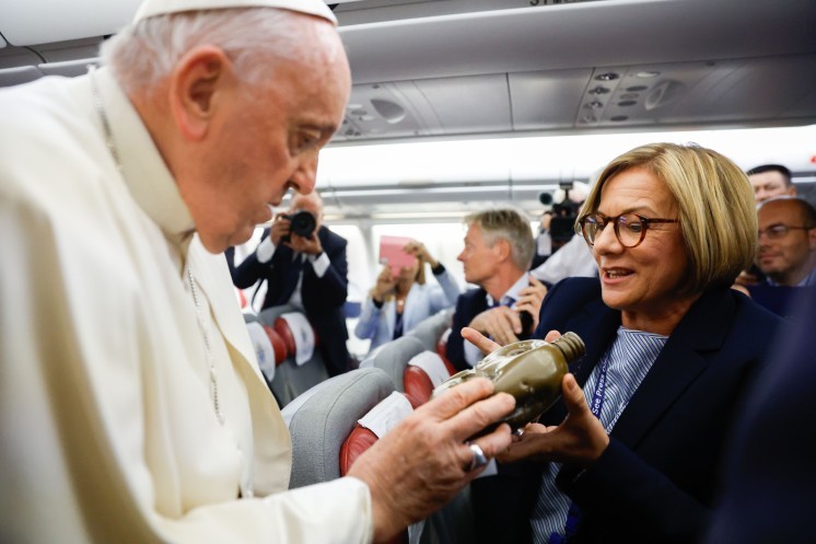 Pope Francis blesses a canteen from Ukraine.