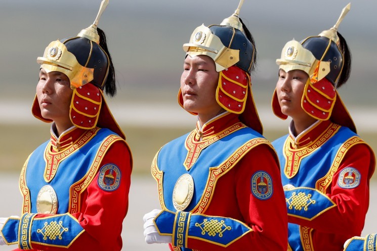 A Mongolian honor guard welcomes Pope Francis.
