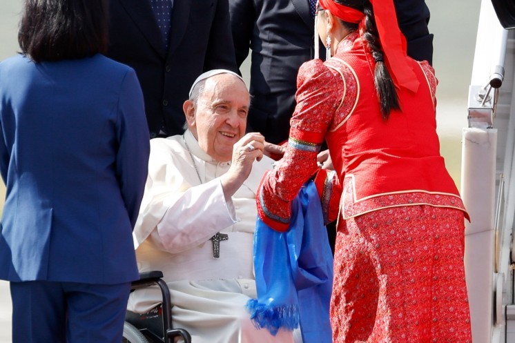 Pope Francis tries a traditional Mongolian treat.