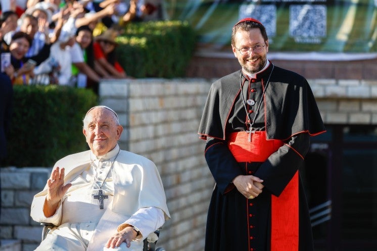 Pope Francis and Cardinal Giorgio Marengo outside Sts. Peter and Paul Cathedral in Ulaanbaatar, Mongolia.