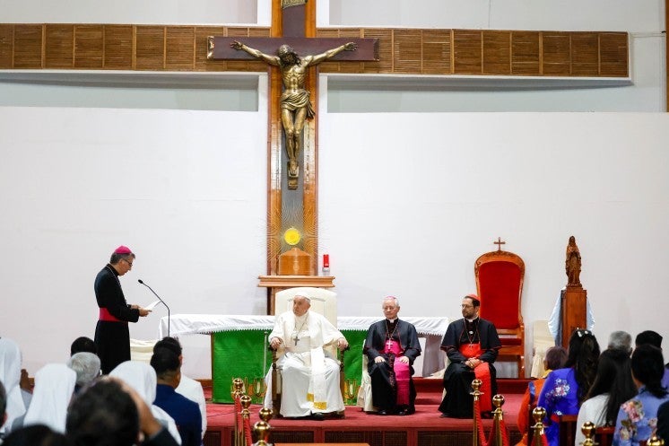 Bishop José Luis Mumbiela Sierra greets Pope Francis.