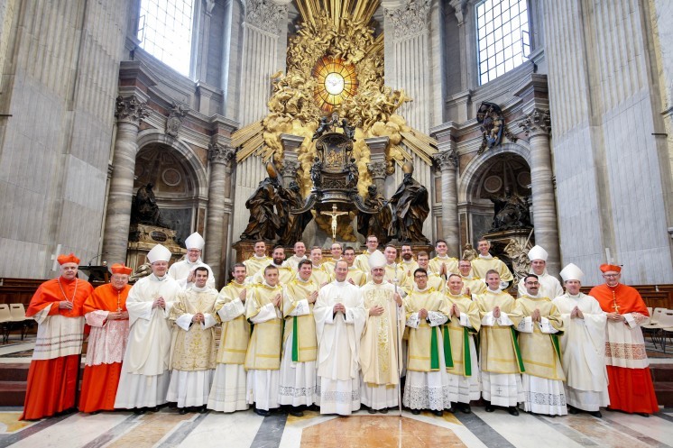 Eighteen newly ordained deacons from Rome's Pontifical North American College pose for a group photo.