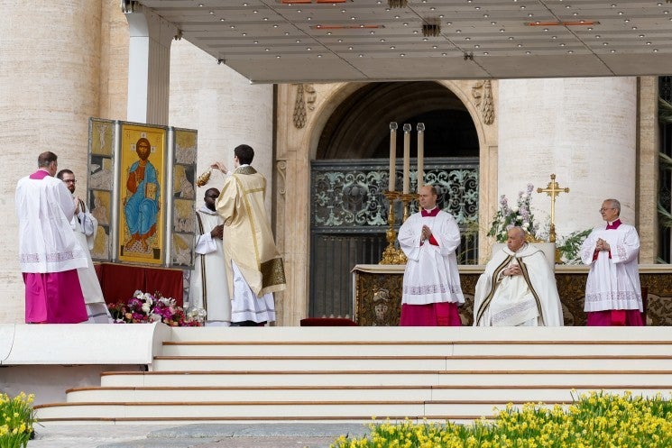 Pope Francis looks at at icon of Christ.