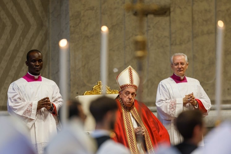 Pope Francis observes the entrance procession during Mass.