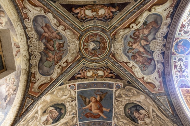 The frescoed ceiling of the cloister